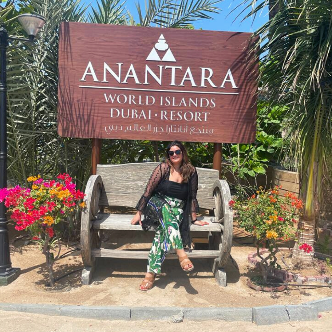 Cherry sitting on a bench outside at Anantara Resort